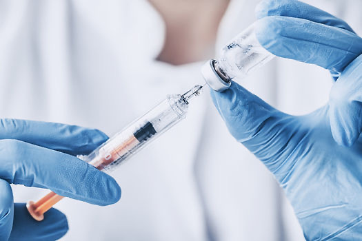 Vaccine vial and syringe